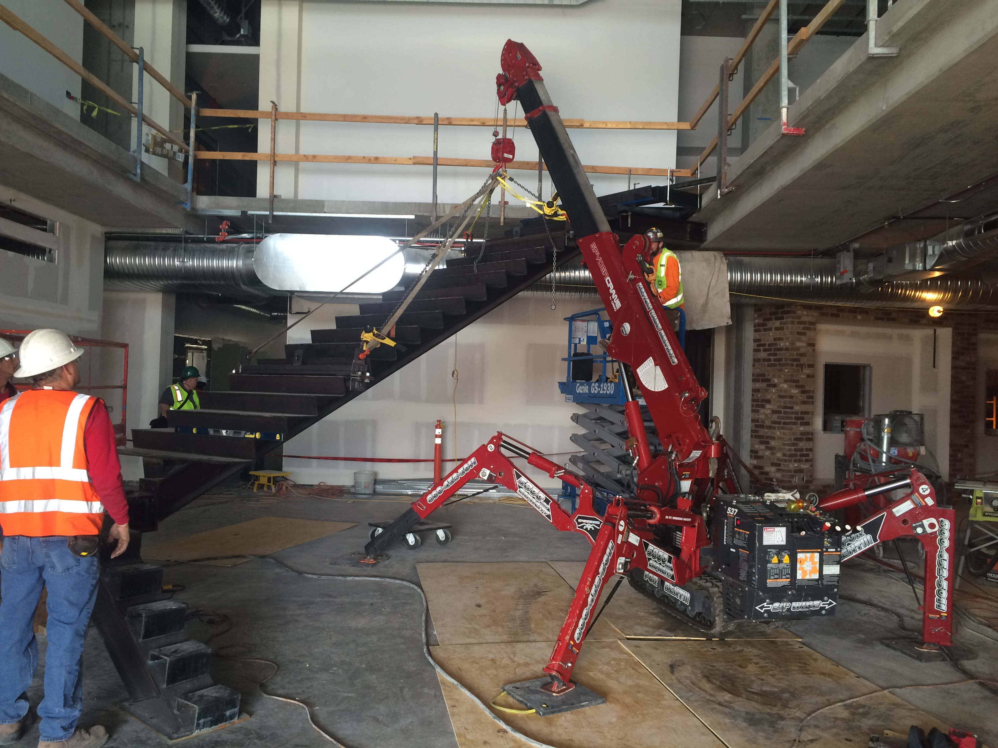 SPYDERCRANE&reg; mini crane on a jobsite